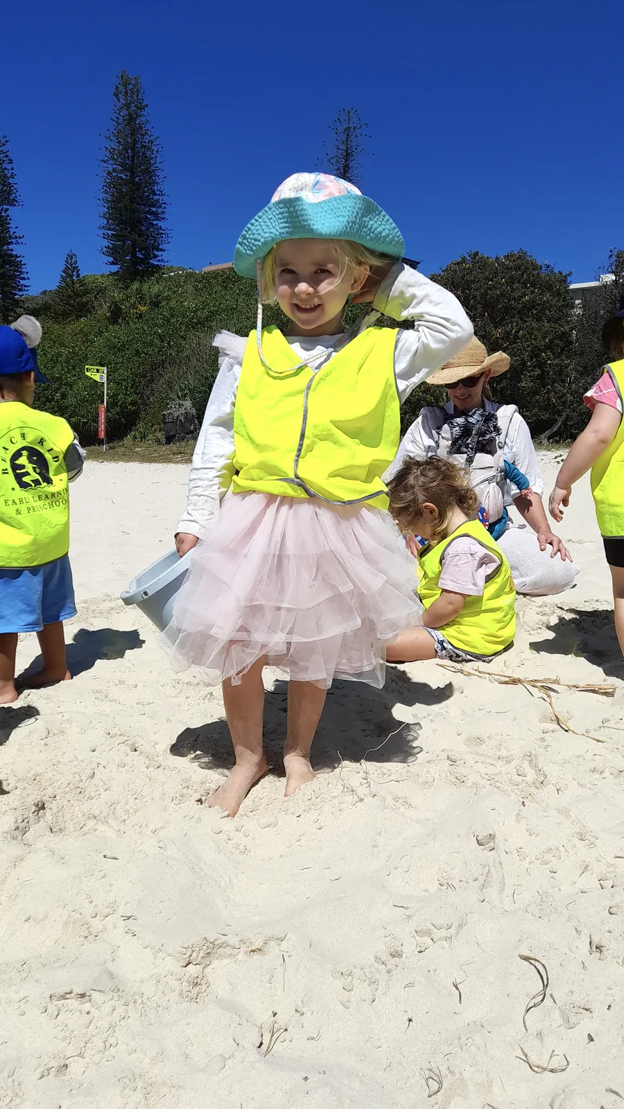 A child investigating the shoreline on a Beach Kinder excursion