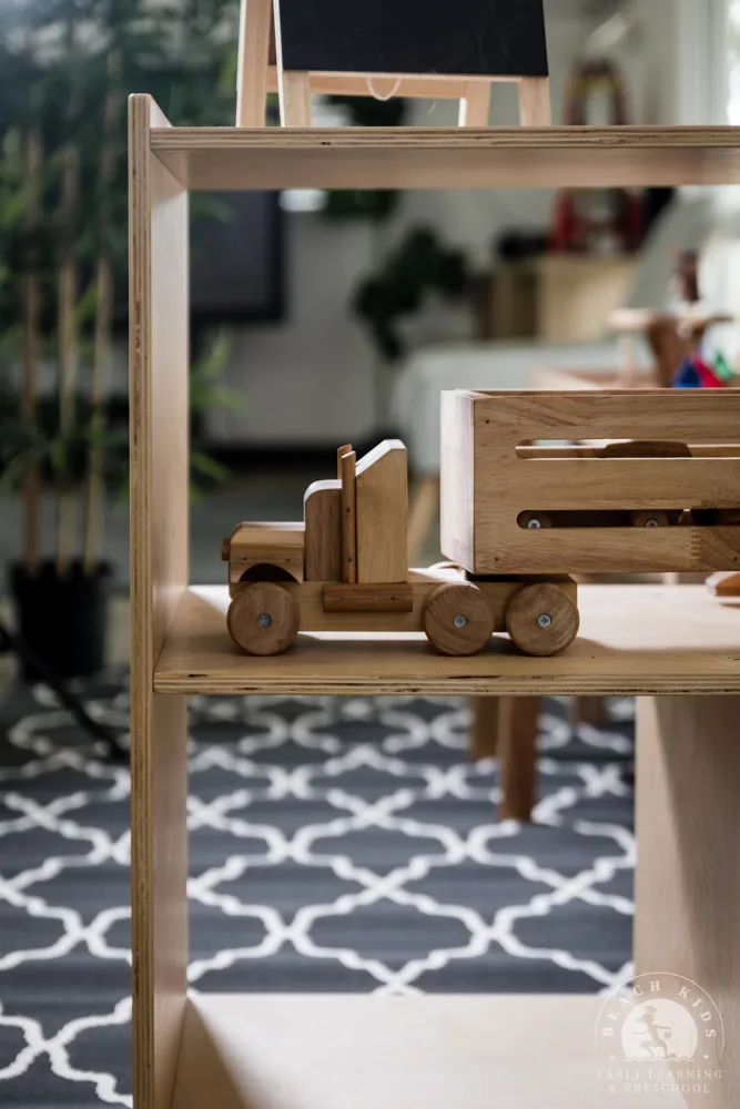 Wooden vehicles and blocks on a shelf in a Cabarita classroom